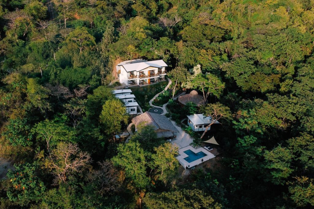 An aerial shot of Ananda Lodge surrounded by Costa Rica's natural jungle.