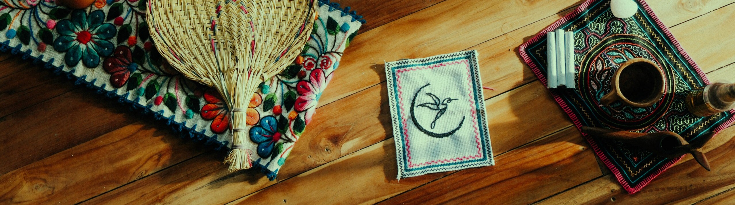 Beautiful green and purple objects laid out on a tapestry at an ayahuasca retreat Wyoming residents are attending.