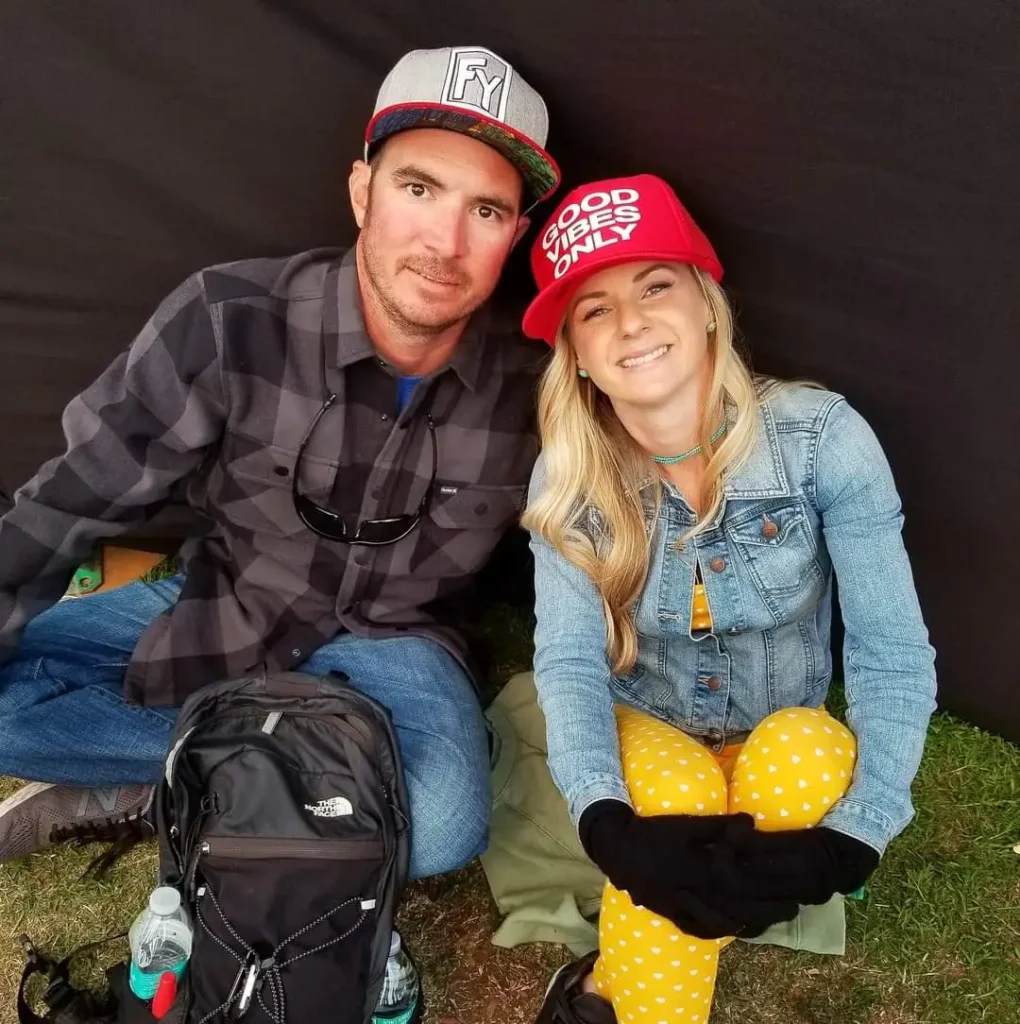 A couple sits together in comforatble clothing sharing their ayahuasca experience stories.
