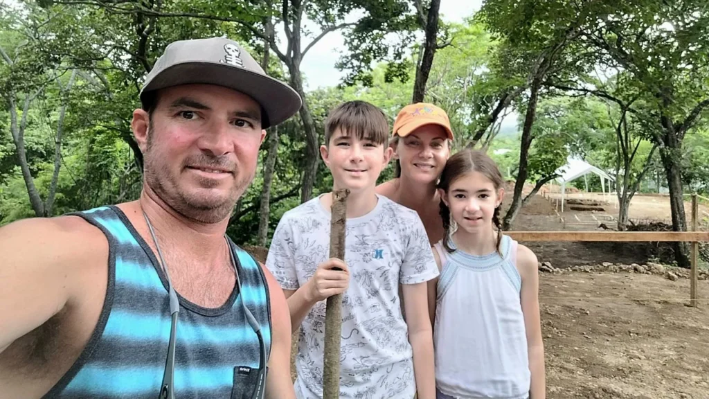 Family smiling as they constructing Ananda Lodge, a sacred retreat center where many ayahuasca experience stories have taken root