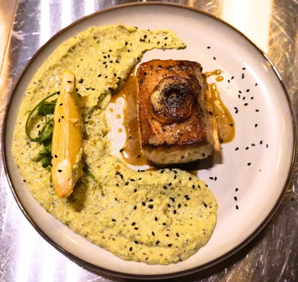 A plant of artful potatoes and salmon offered at a Costa Rica retreat, perfect for those planning to host a retreat with wellness-focused dining