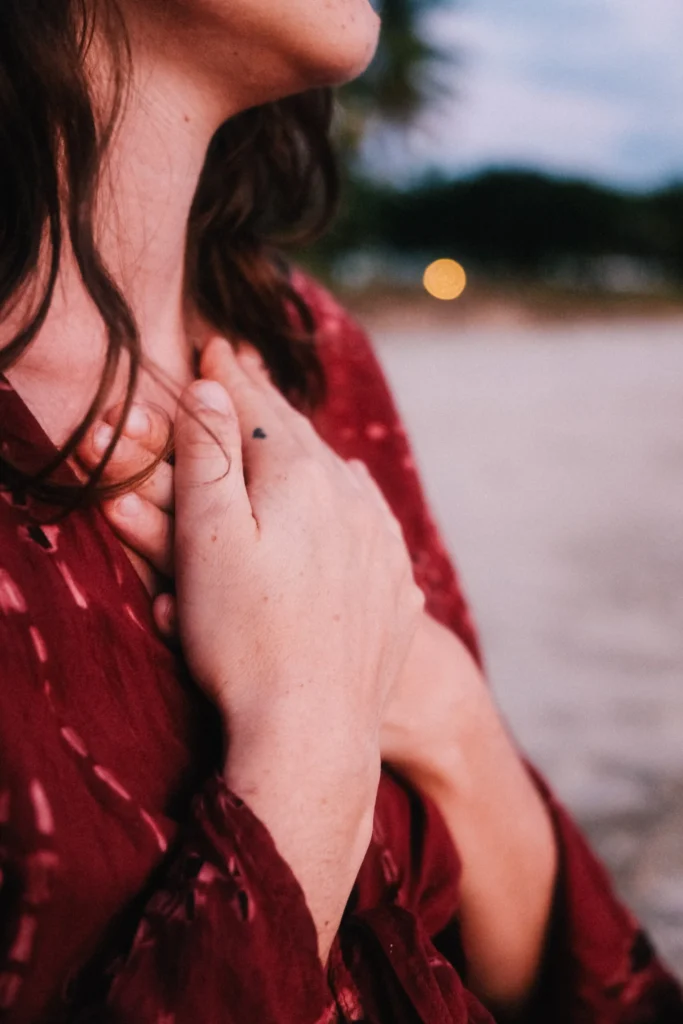 Woman in quiet reflection during integration at a psilocybin retreat in Costa Rica, reconnecting with self in a peaceful jungle beach setting