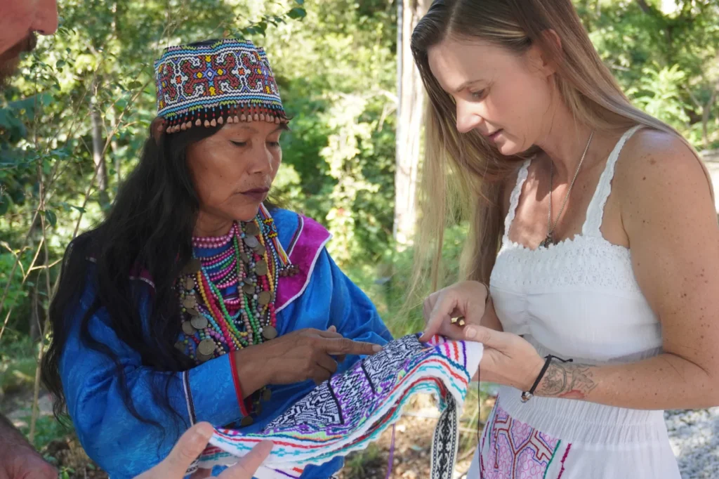 Shipibo women gathered sharing their ayahuasca experience stories, honoring each other’s journeys and breakthroughs